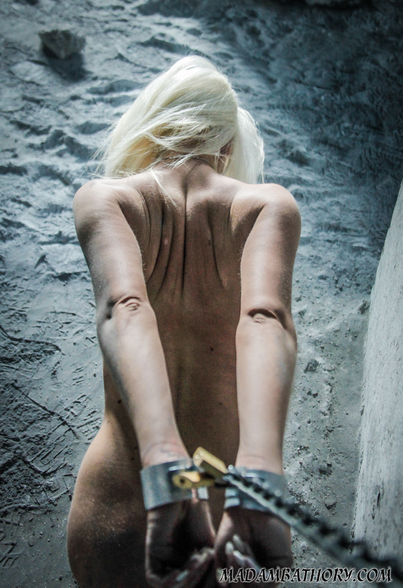 BDSM nude teen in chains outdoor 