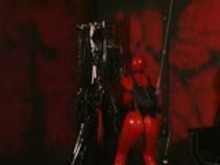 Latex slave in restraints
