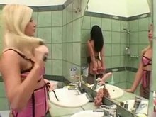 Lesbian Strap-on Mistress and her brunette slave girl