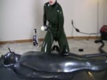Femdom - Latexgirl using Man in Vacbed