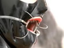 Latex Mistress and hooded sub girl