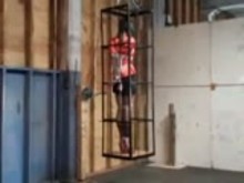 Caged in tight bondage