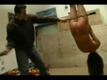 Suspended tied and beaten sub girl