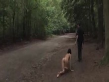 Slut taken for a walk in public park