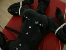 Rubber slave forced to cum