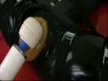 Rubber slave taken to cum
