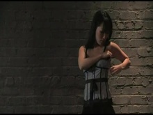 Gagged brunette in dungeon