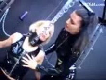 Slave-Girl-Tied-To-Frame-Getting-Her-Tits-Rubbed-Tortured-With-Clips-Whipped-By-Mistress-In-The-Dungeon