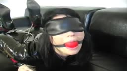 Gagged and restrained in catsuit