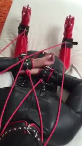 Tied cocksucker in latex