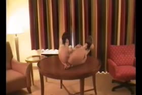 Busty blonde ball gagged on table