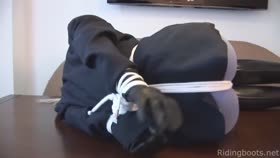 Riding boots, ropes and table