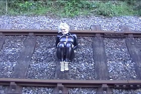 Katarina Nikita in latex on the railroad