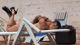 Sun tanning by the pool