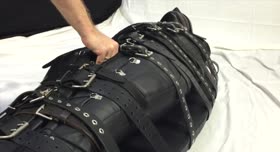 Restrained with 20 belts in heavy leather