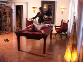 Helpless male slave on the pool table