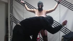 My hooded slave bound to cum
