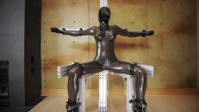 Locked tight to Bondage Chair in Rubber