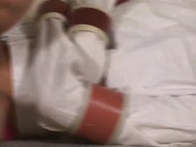 Nicole Struggles in Straitjacket