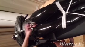 Latex Gimp in Chastity