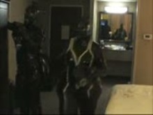 Two Girls in Rubber Wearing Gas Masks