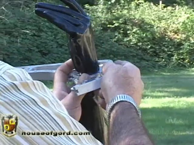 Jewell in Latex Hood and Metal Cuffs Outdoors