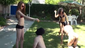 Two Dommes In Bikinis Train Two Naked Male Slaves As