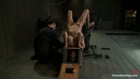 Hot skinny MILF with big tits, is bound in a custom metal device. Brutally fucked, and zippered.