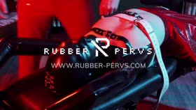 latex slave with rubber finest mask receives blowjob