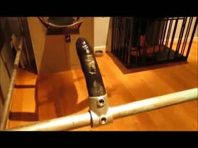 Slave impaling himself on large dildo